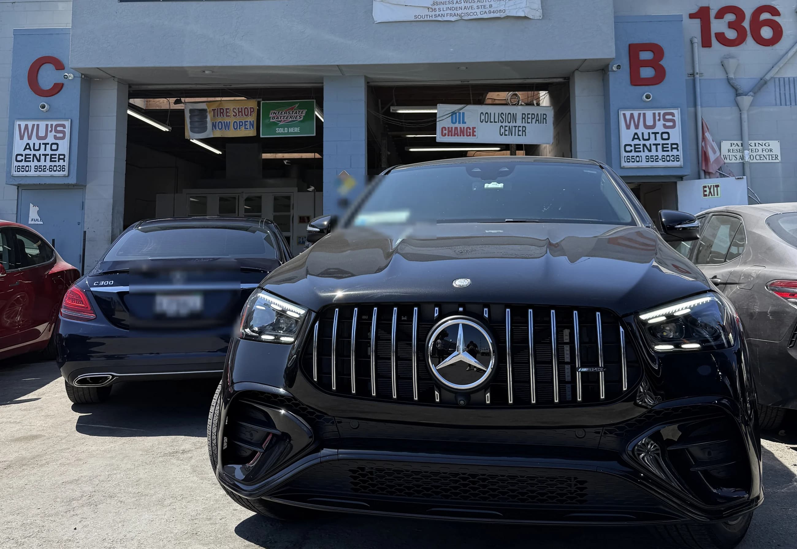 A Mercedes-AMG GLE and C 300 outside the Wu's Auto Center repair bays on South Linden Ave