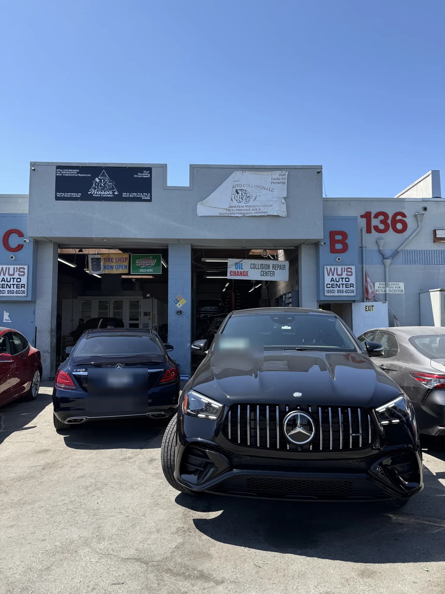 Mercedes-AMG parked in front of the Wu's Auto Center bays